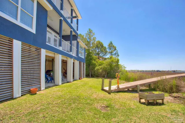 a view of a building with a yard