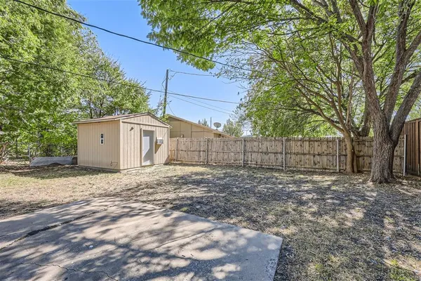 a house with a trees in the background