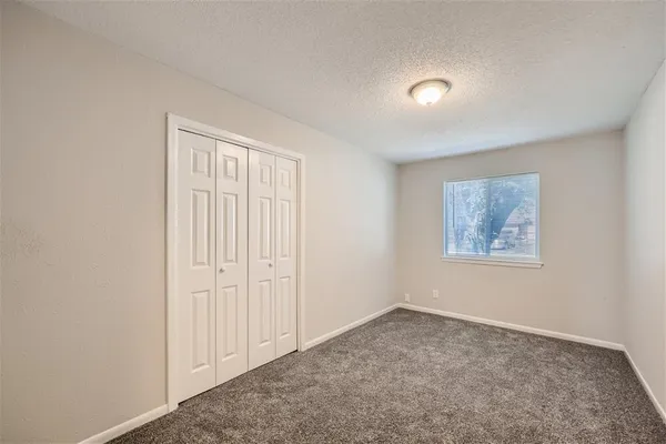 an empty room with a empty space and window