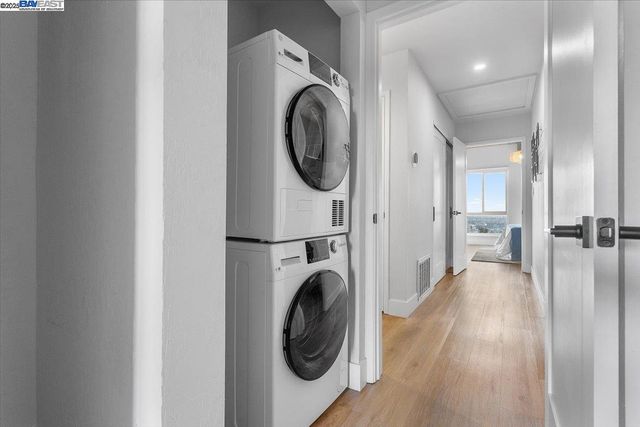a view of a hallway with washer and dryer