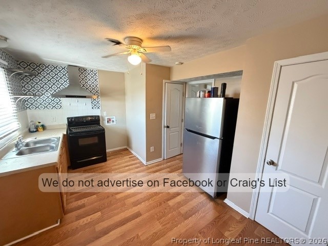 6467 Yadkin Road, Unit 1 Fayetteville, NC 28303 - Photo 3 of 9 a bedroom with a bed and a flat screen tv