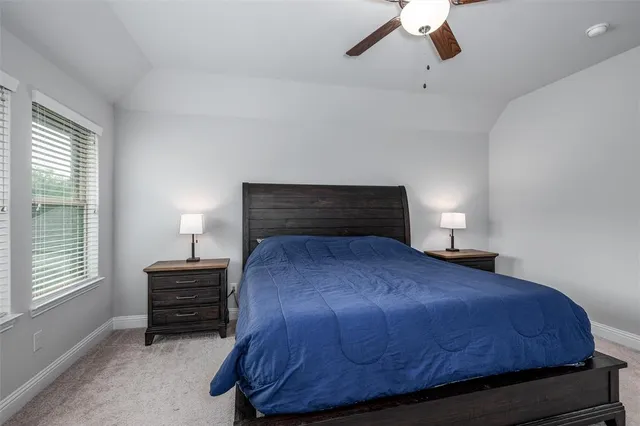 a bedroom with a bed and dresser