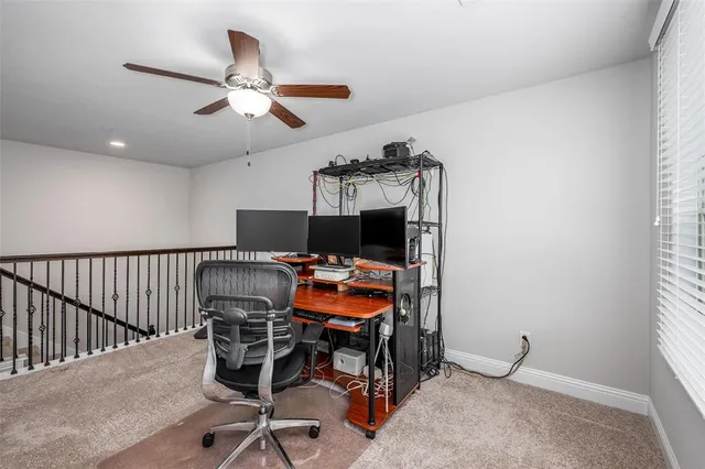 a workspace with furniture and window