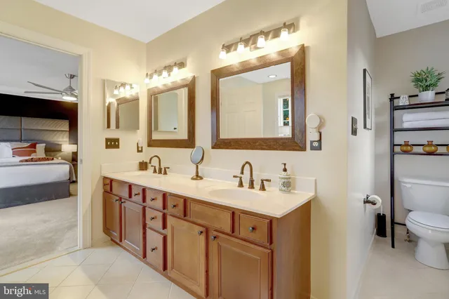 a bathroom with a sink double vanity and a mirror