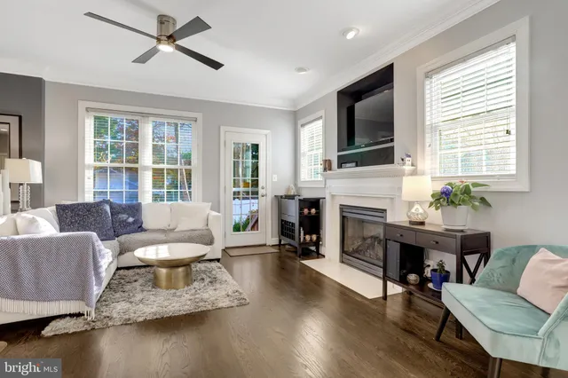 a living room with furniture fireplace and flat screen tv
