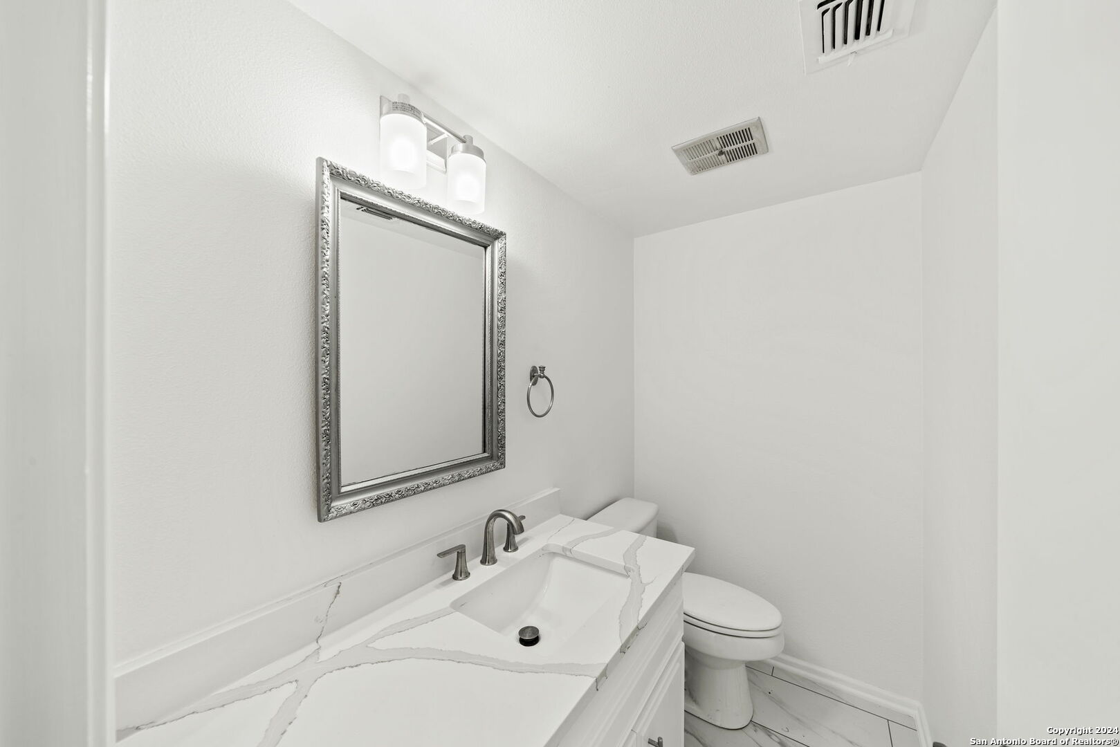6106 Vance Jackson Road, Unit 50 San Antonio, TX 78230 - Photo 17 of 30 a bathroom with a sink toilet and mirror