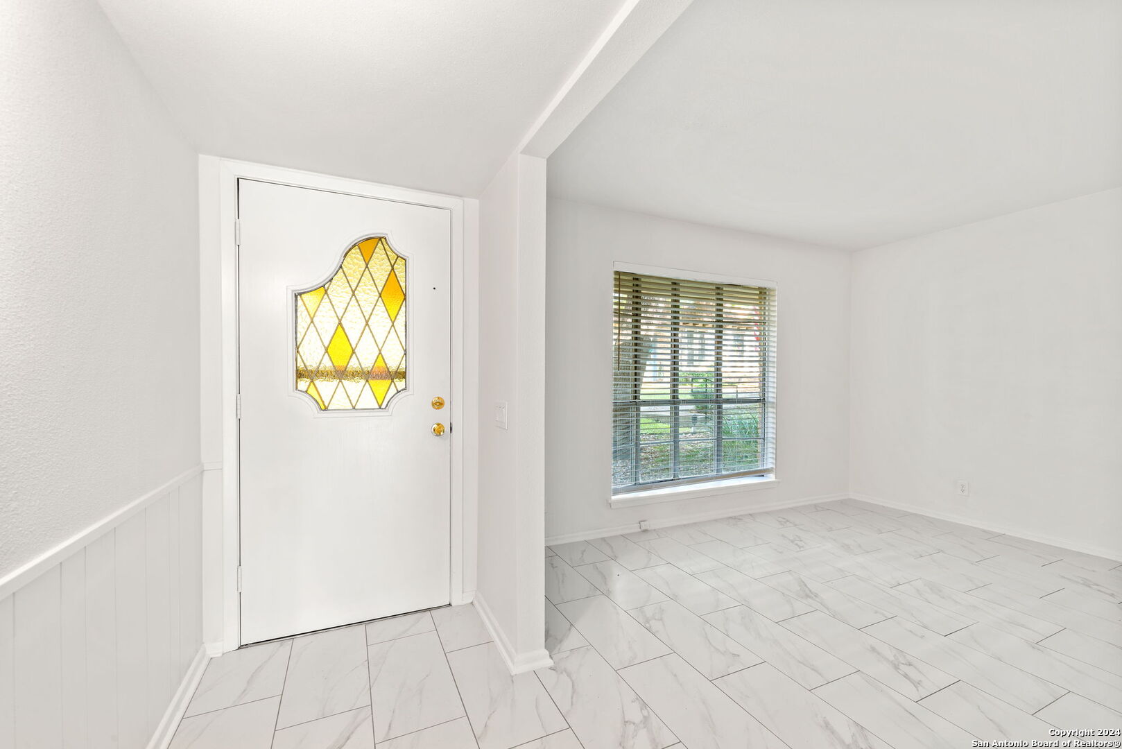 6106 Vance Jackson Road, Unit 50 San Antonio, TX 78230 - Photo 21 of 30 an entryway with wooden floor and a window