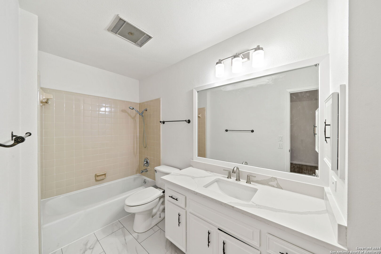 6106 Vance Jackson Road, Unit 50 San Antonio, TX 78230 - Photo 23 of 30 a bathroom with a sink a toilet and shower