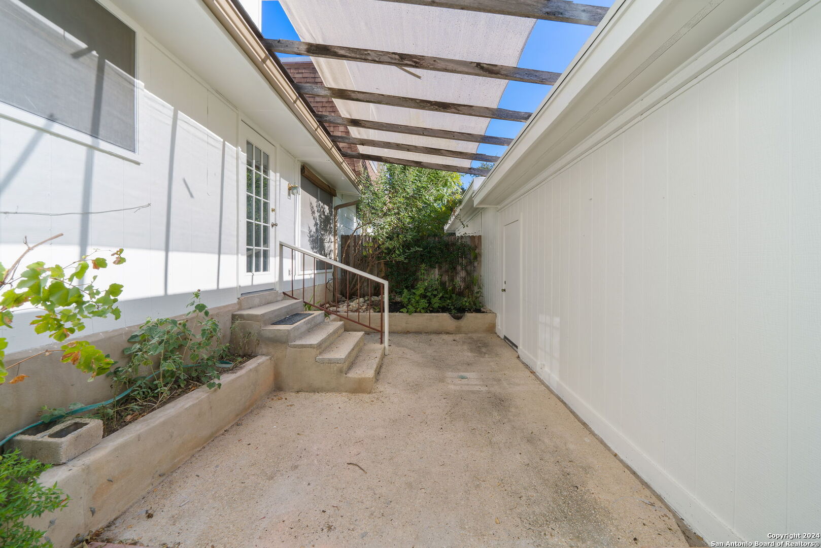 6106 Vance Jackson Road, Unit 50 San Antonio, TX 78230 - Photo 29 of 30 a view of a house with a yard