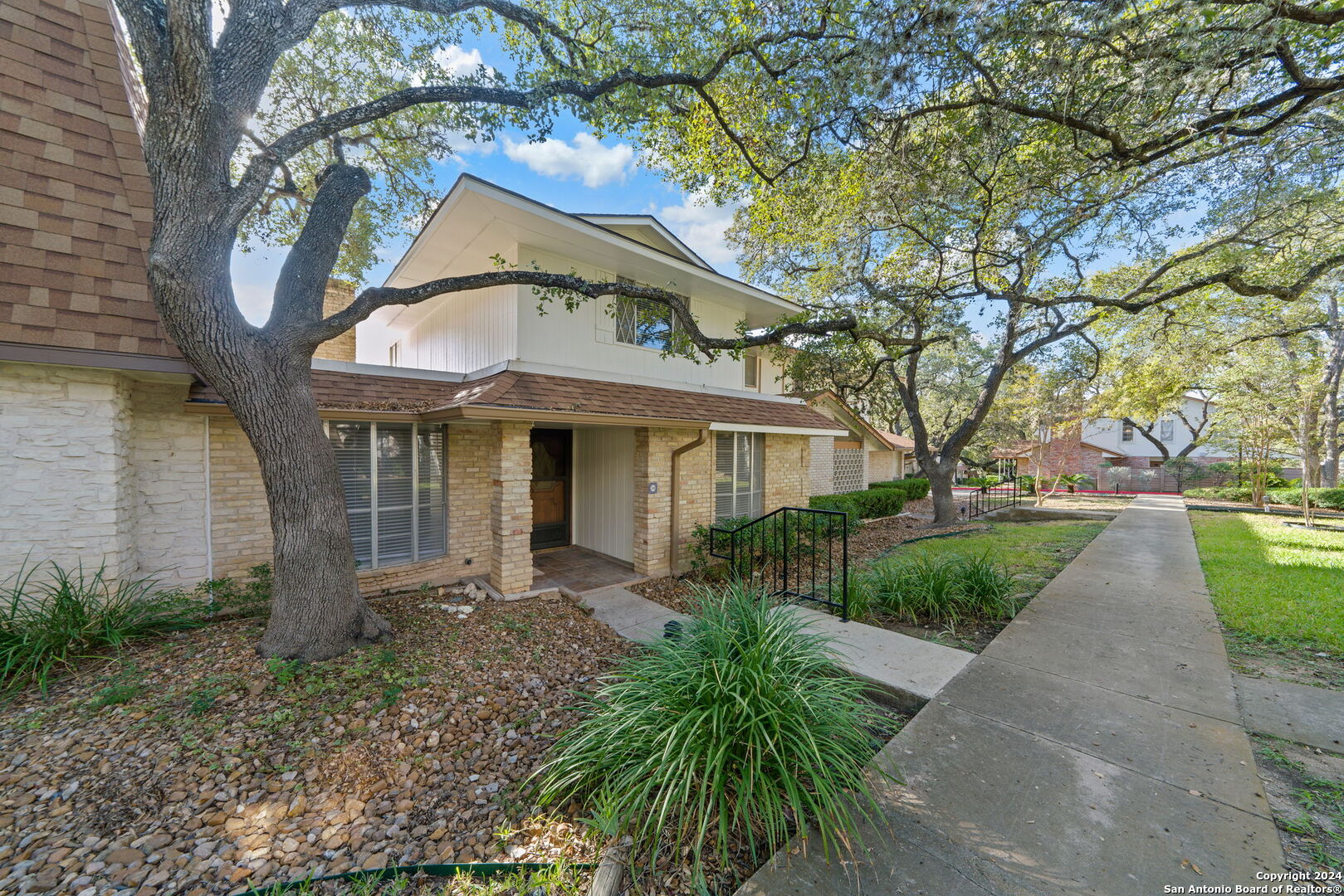 6106 Vance Jackson Road, Unit 50 San Antonio, TX 78230 - Photo 4 of 30 a front view of a house with garden