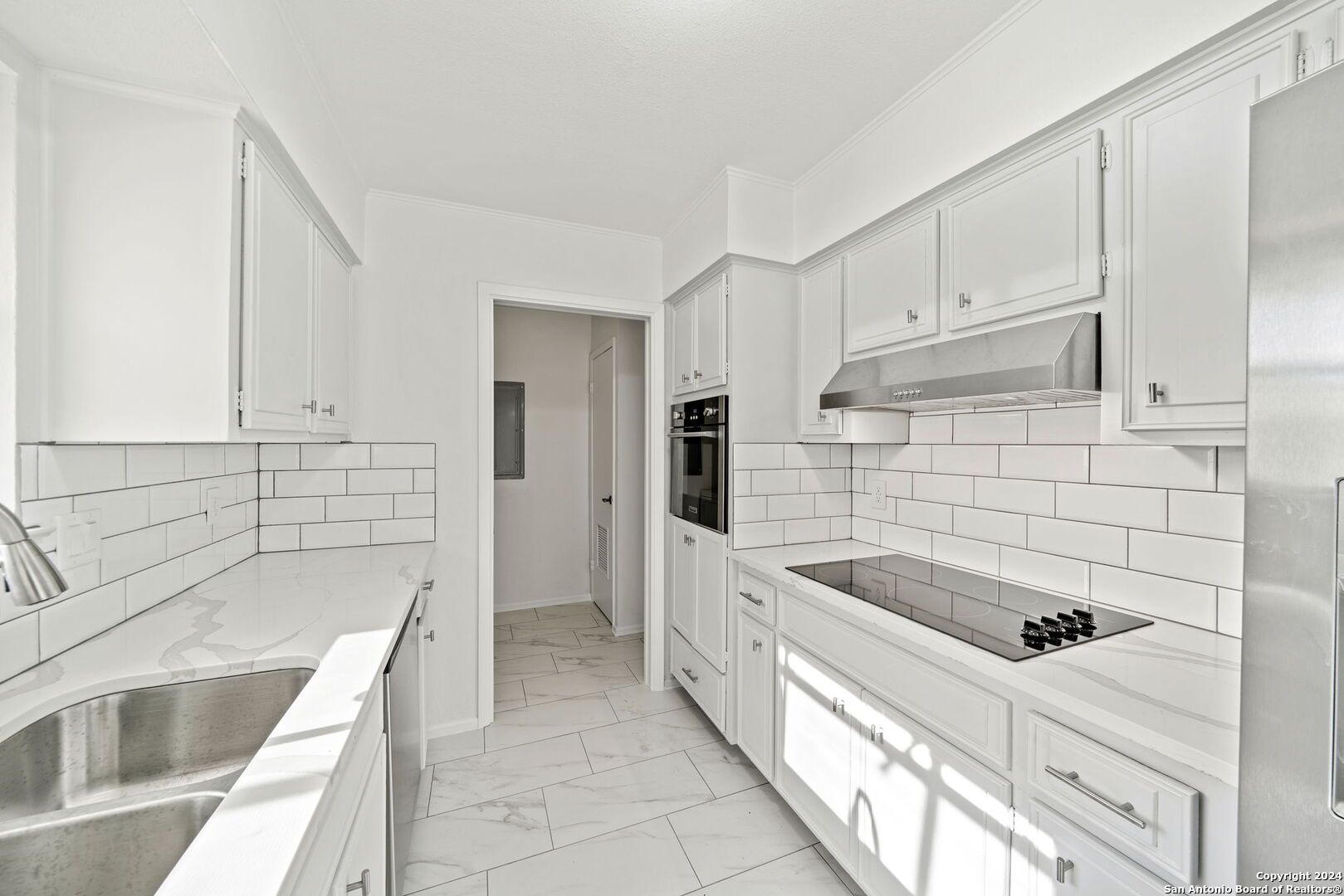 6106 Vance Jackson Road, Unit 50 San Antonio, TX 78230 - Photo 7 of 30 a kitchen that has a sink and a stove