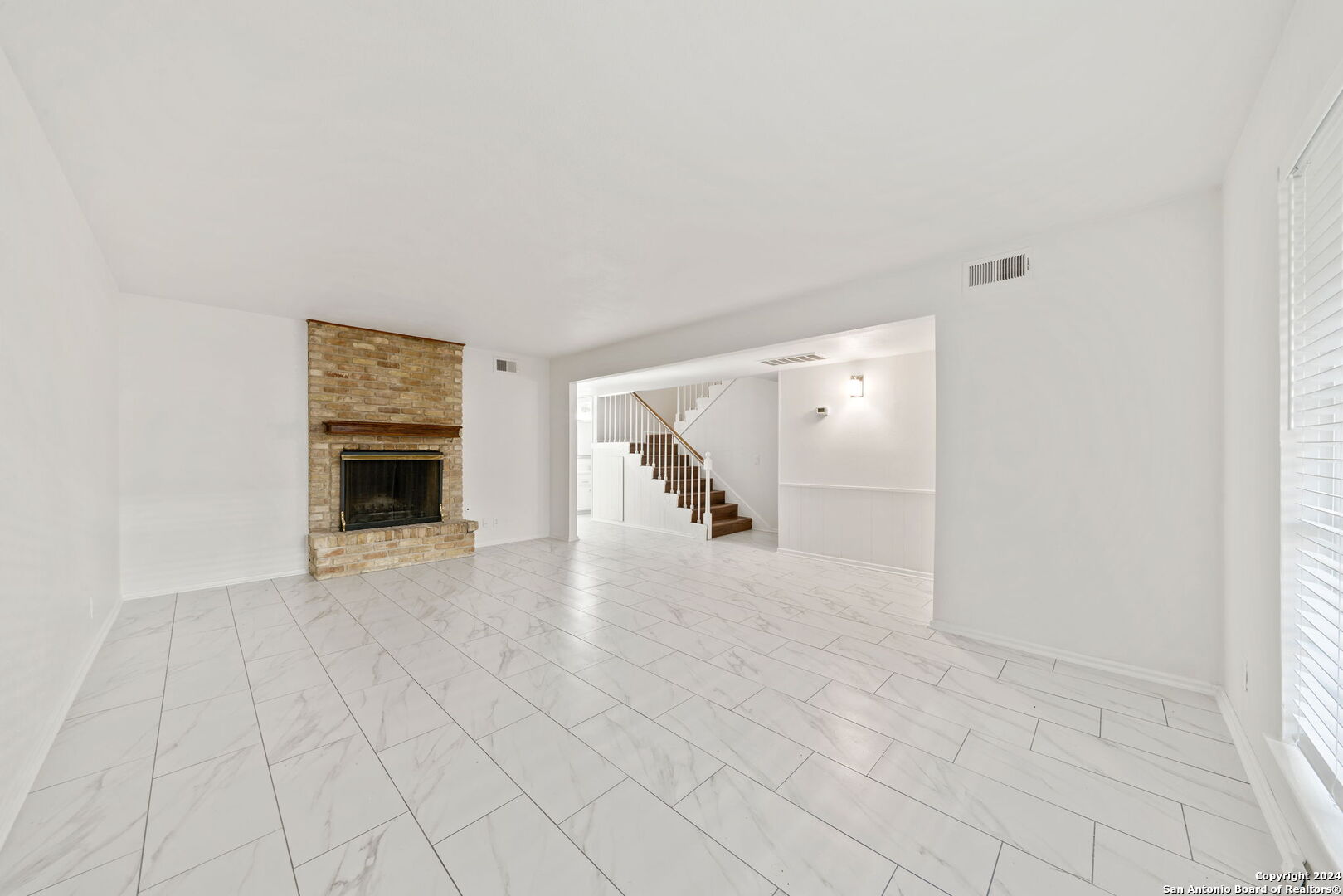 6106 Vance Jackson Road, Unit 50 San Antonio, TX 78230 - Photo 10 of 30 an empty room with fireplace