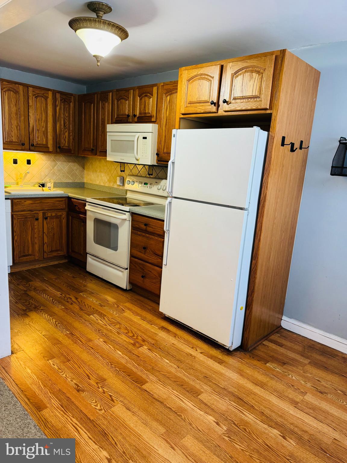 5237 North Springfield Road Clifton Heights, PA 19018 - Photo 4 of 13 a kitchen with a refrigerator and a stove top oven