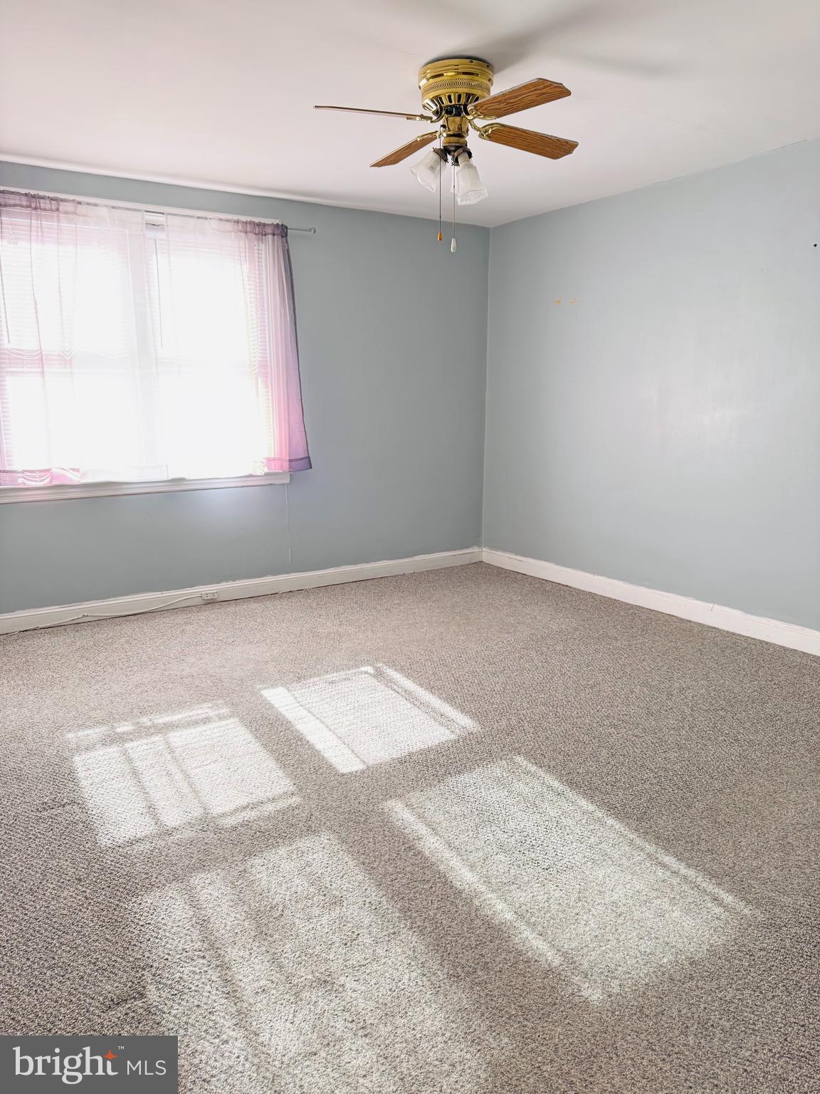 5237 North Springfield Road Clifton Heights, PA 19018 - Photo 6 of 13 an empty room with windows and fan