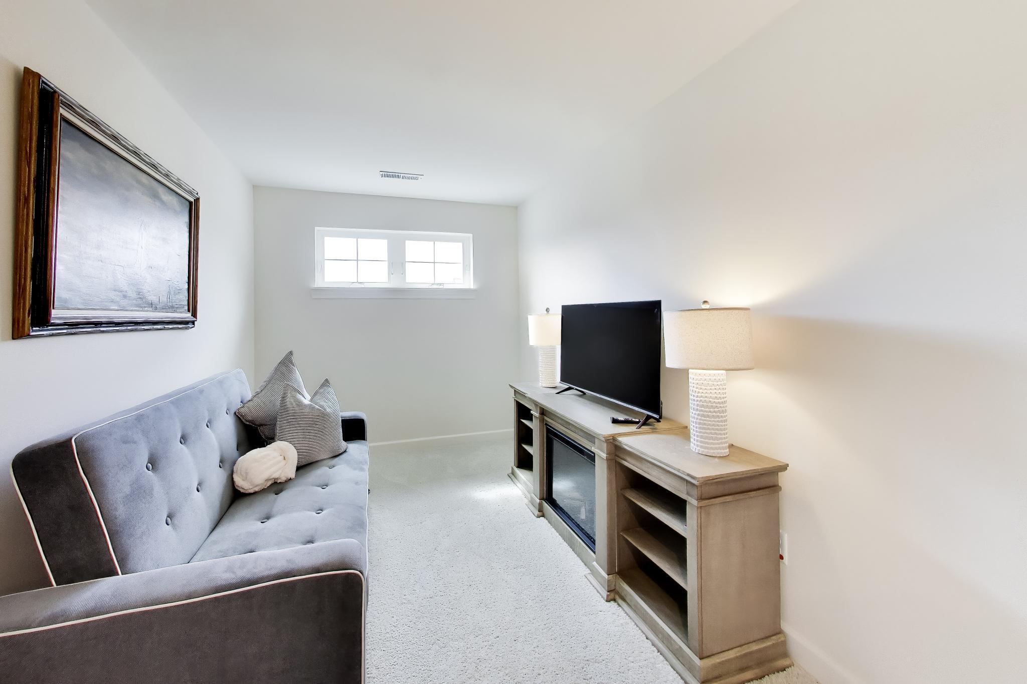 2730 Harbor Court Delavan, WI 53115 - Photo 25 of 47 Upper-level sitting room with natural light and flexible secondary living space.
