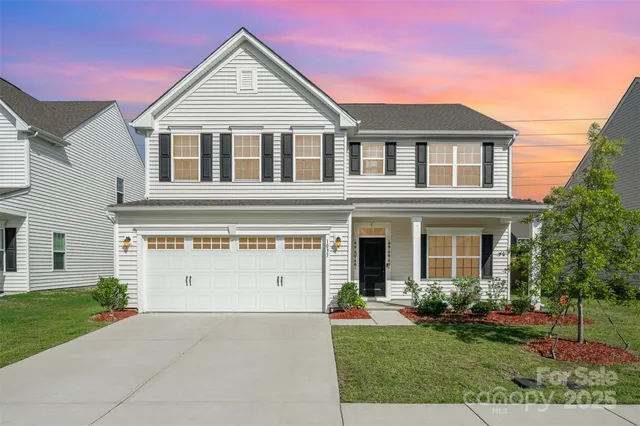 a view of a yard in front view of a house