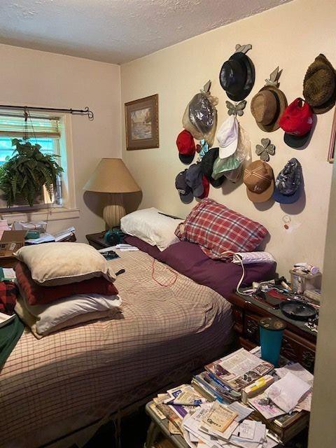 4231 Blanton Avenue Southwest Atlanta, GA 30331 - Photo 6 of 10 a bedroom with a bed and wooden floor