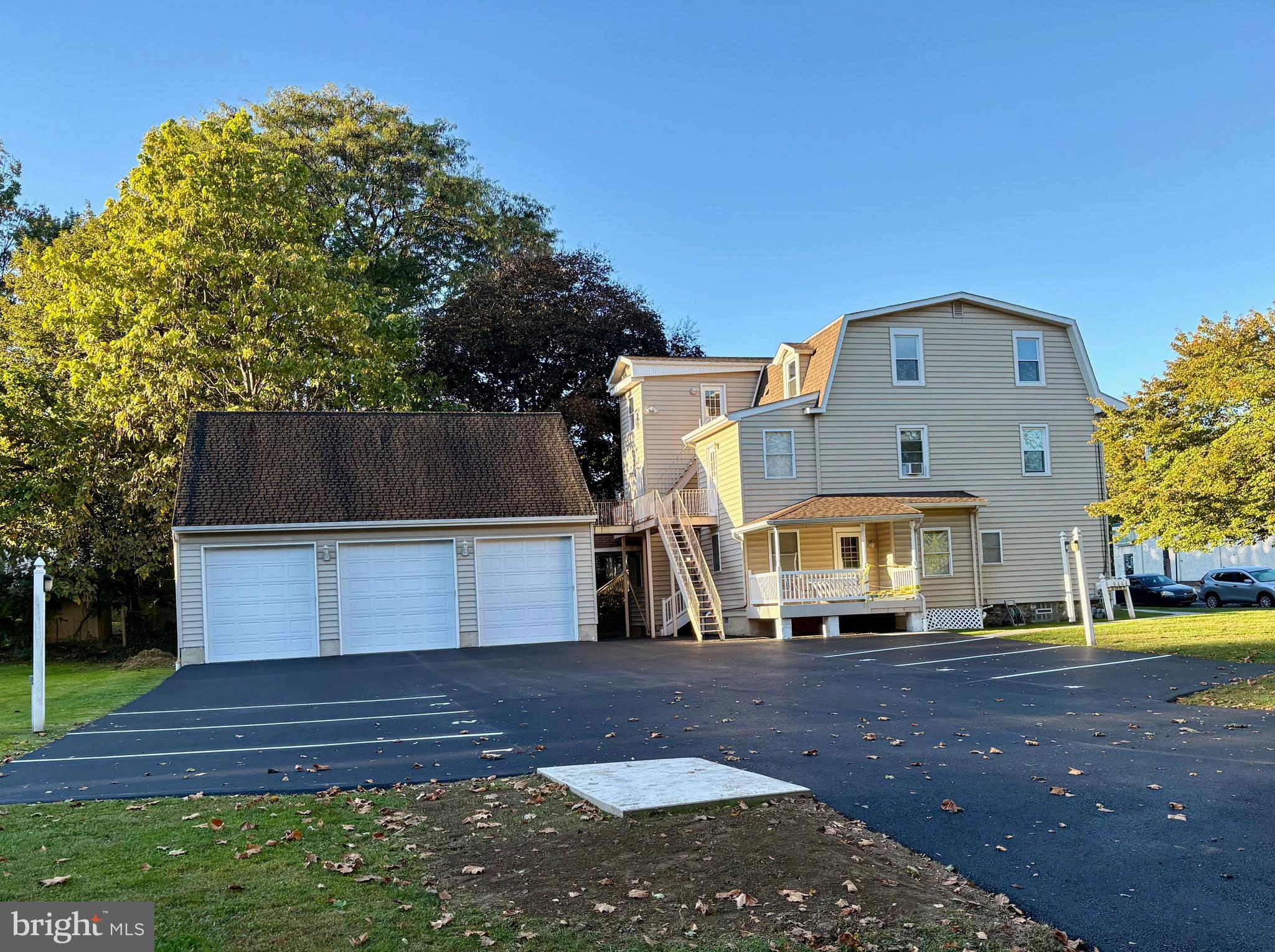 1643 Rockwell Road, Unit 5 Abington, PA 19001 - Photo 19 of 19 a front view of a house with a yard
