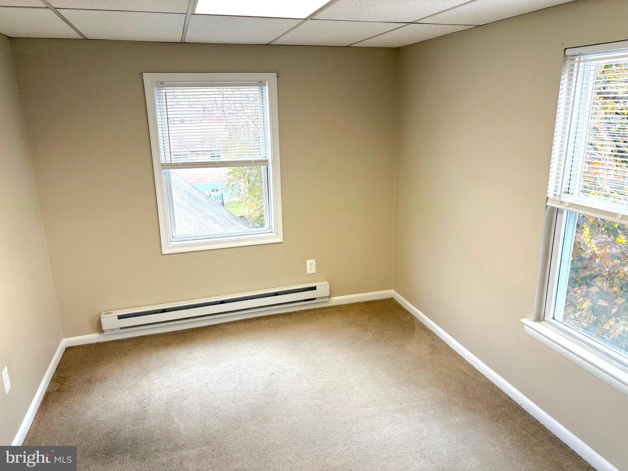 1643 Rockwell Road, Unit 5 Abington, PA 19001 - Photo 8 of 19 an empty room with windows