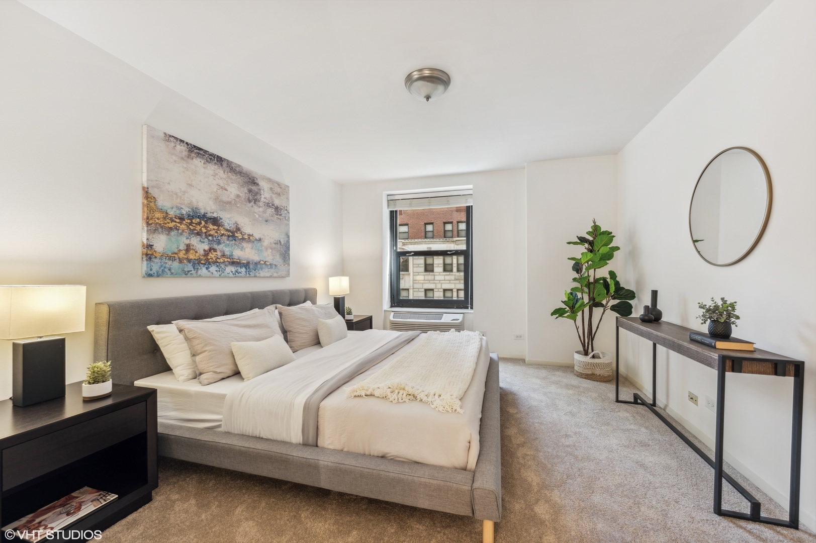 40 East Delaware Place, Unit 301 Chicago, IL 60611 - Photo 14 of 21 a bed room with a bed a potted plant and a window