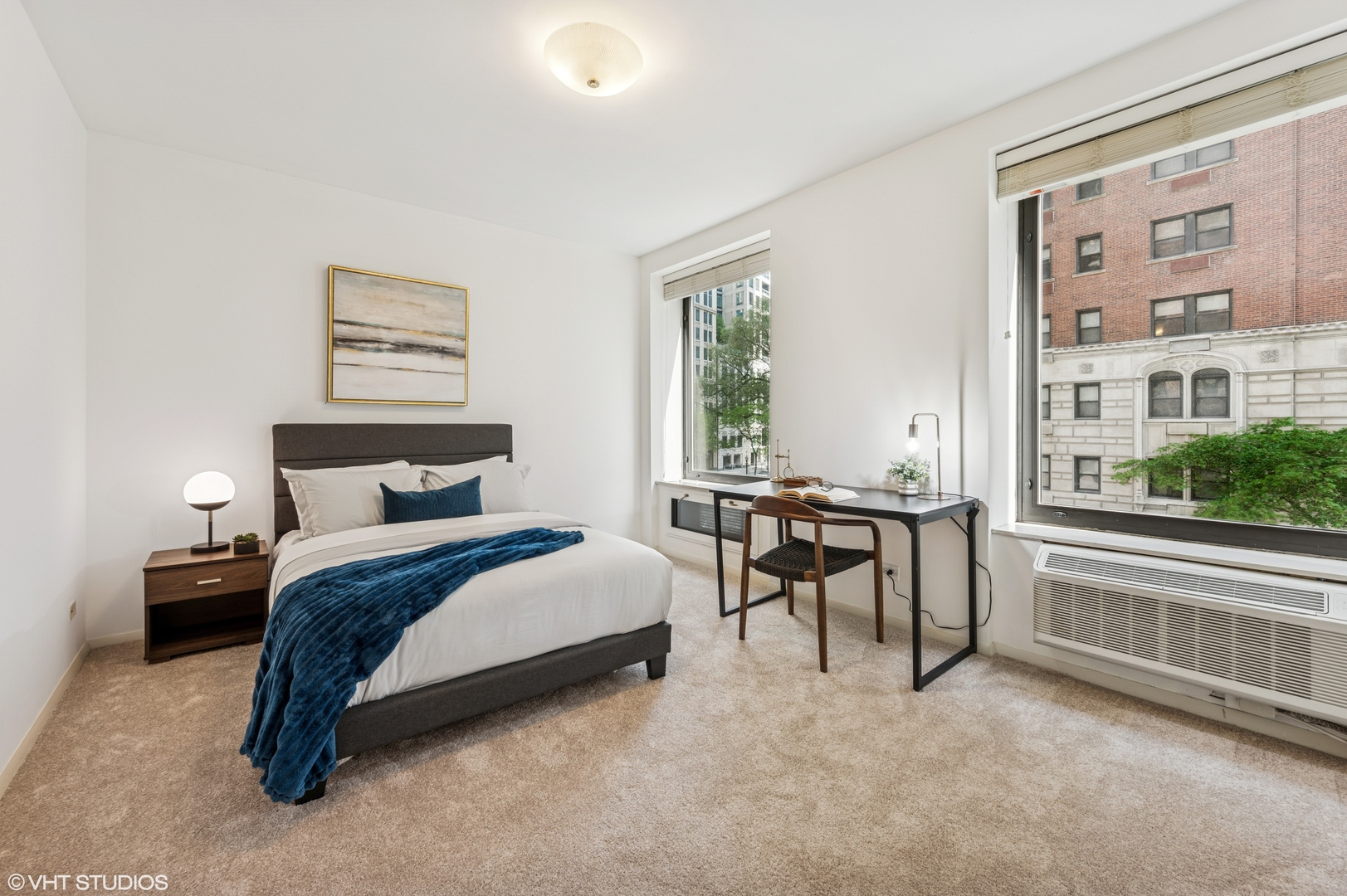 40 East Delaware Place, Unit 301 Chicago, IL 60611 - Photo 16 of 21 a spacious bedroom with a bed and a large window