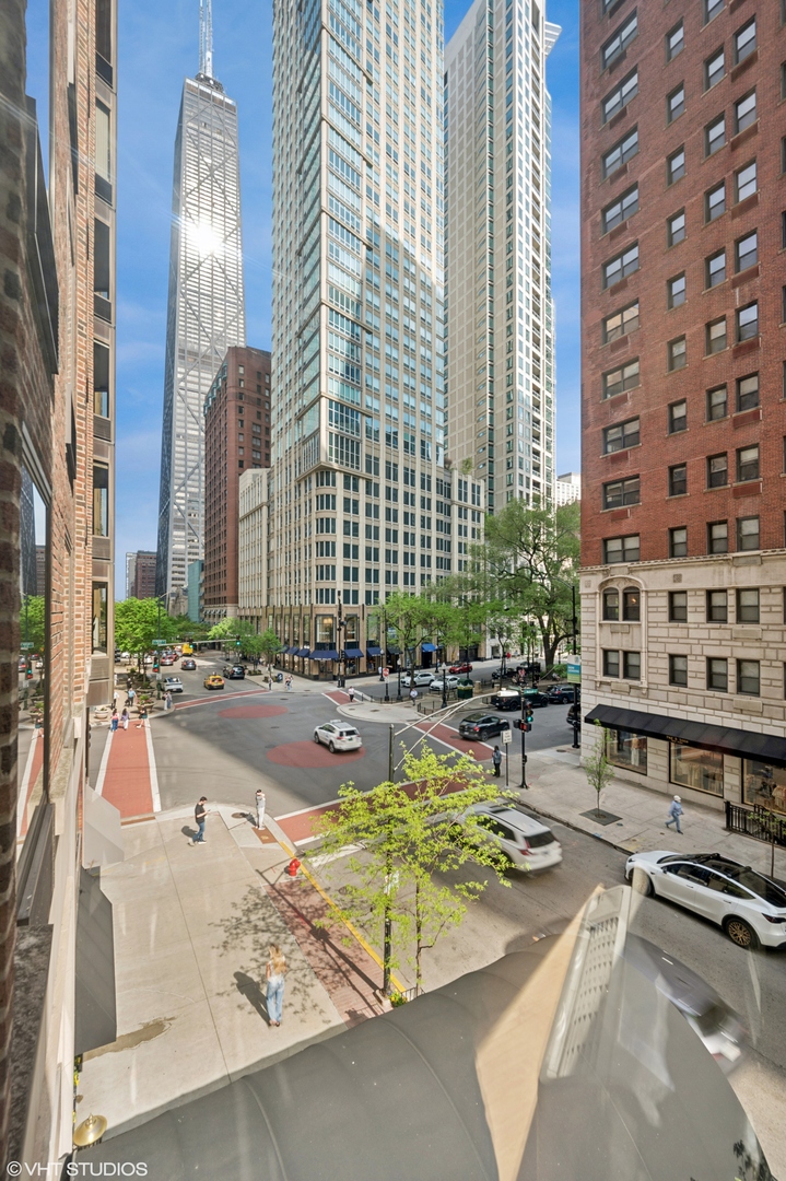 40 East Delaware Place, Unit 301 Chicago, IL 60611 - Photo 19 of 21 a view of a swimming pool with outdoor seating