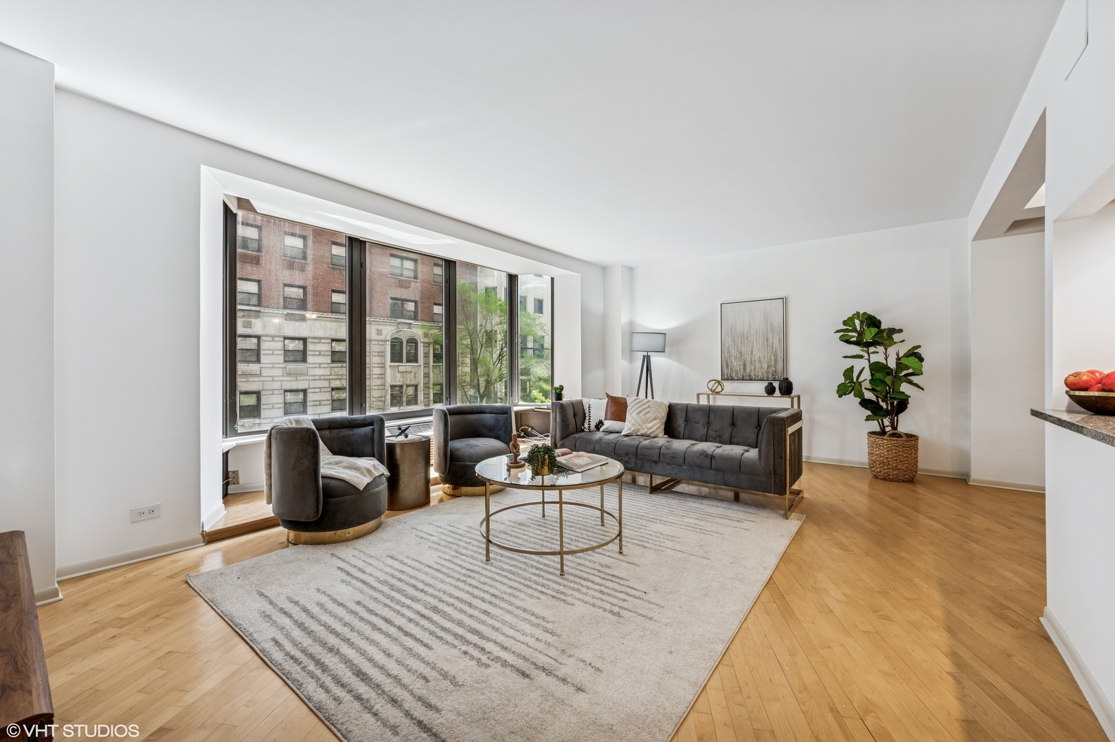 40 East Delaware Place, Unit 301 Chicago, IL 60611 - Photo 4 of 21 a living room with furniture floor to ceiling window and potted plant