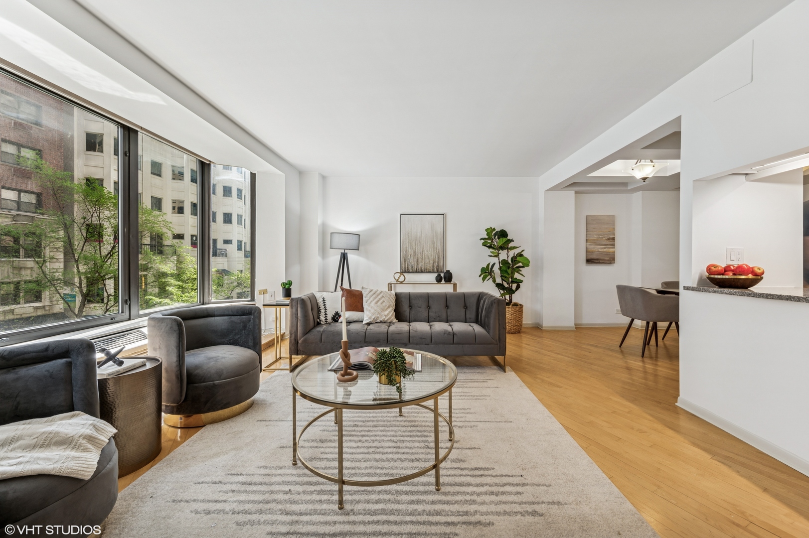 40 East Delaware Place, Unit 301 Chicago, IL 60611 - Photo 7 of 21 a living room with furniture and a large window