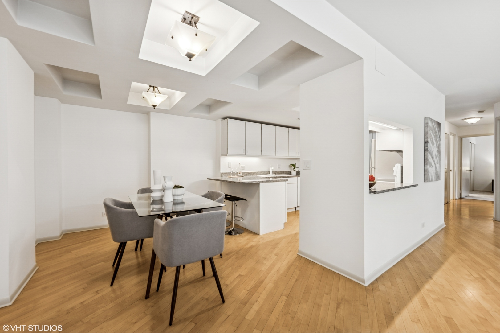 40 East Delaware Place, Unit 301 Chicago, IL 60611 - Photo 10 of 21 a view of a dining room with furniture and wooden floor