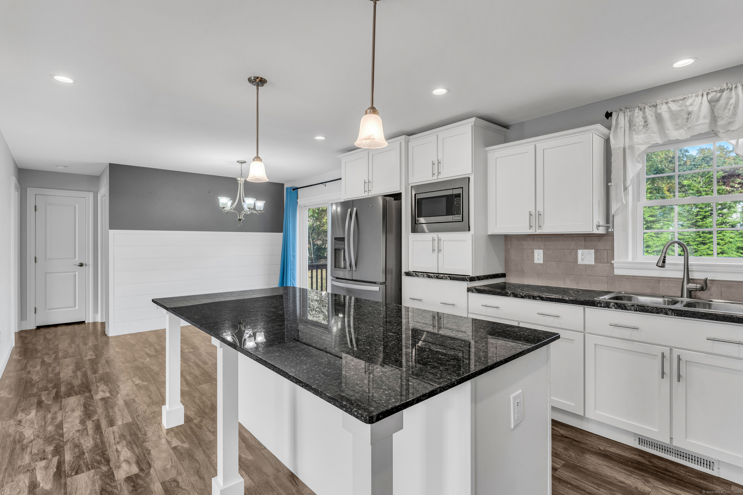 1 High Ridge Circle Montville, CT 06382 - Photo 12 of 39 a kitchen with stainless steel appliances granite countertop a sink a center island and cabinets