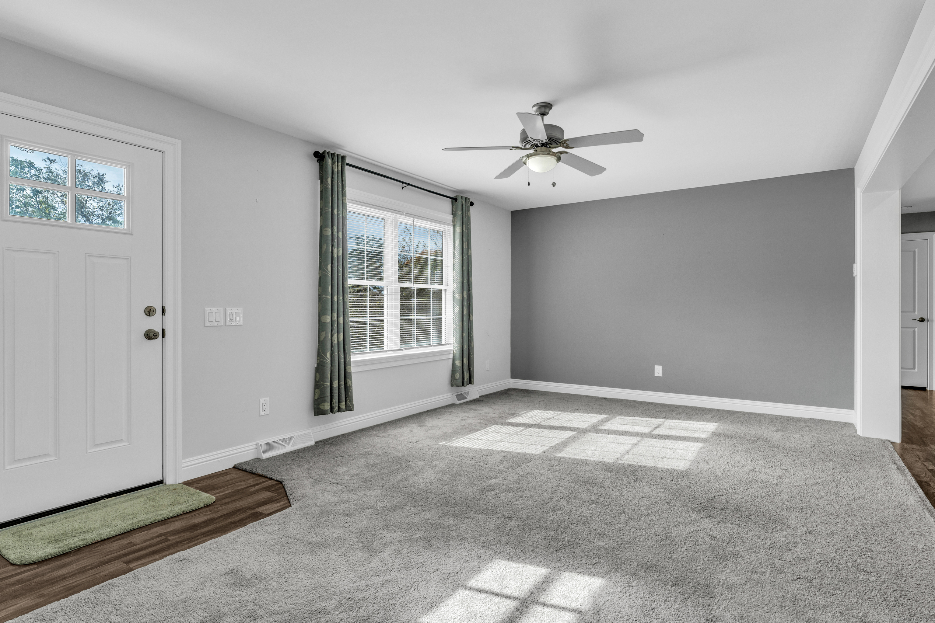 1 High Ridge Circle Montville, CT 06382 - Photo 29 of 39 an empty room with windows and fan