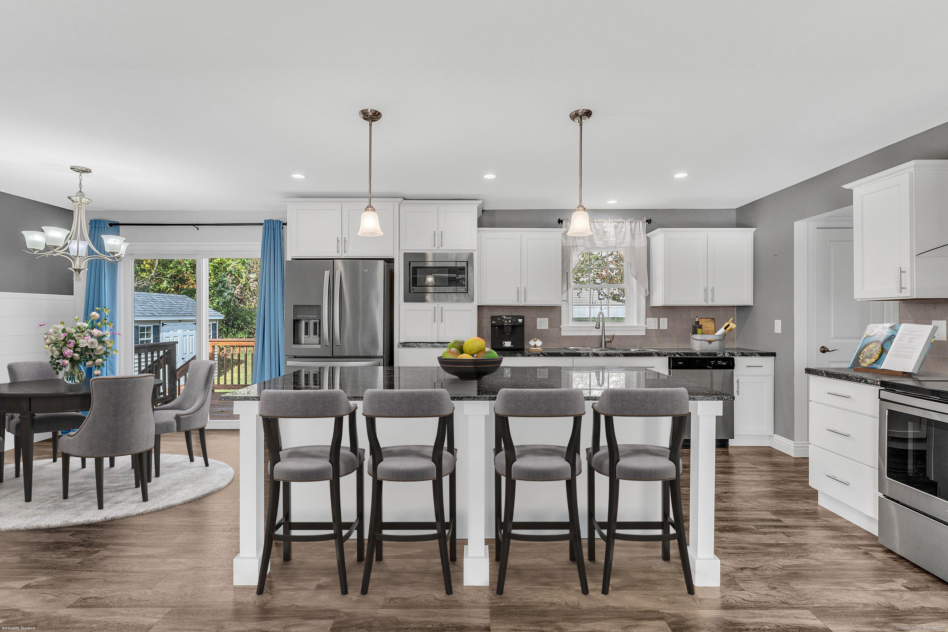 1 High Ridge Circle Montville, CT 06382 - Photo 6 of 39 a kitchen with stainless steel appliances kitchen island granite countertop a dining table chairs and white cabinets