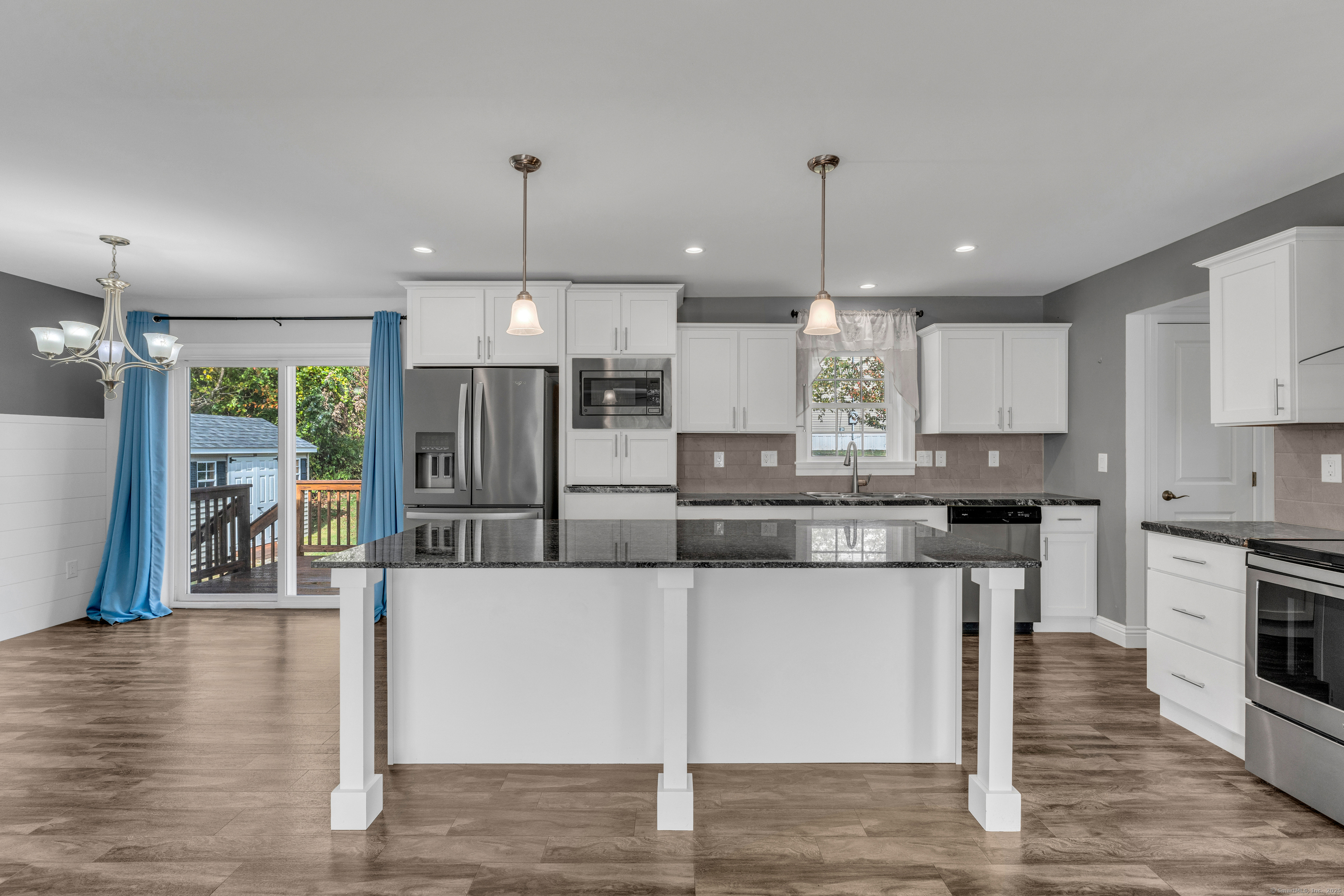 1 High Ridge Circle Montville, CT 06382 - Photo 7 of 39 a large kitchen with granite countertop a large counter top a sink stainless steel appliances and cabinets