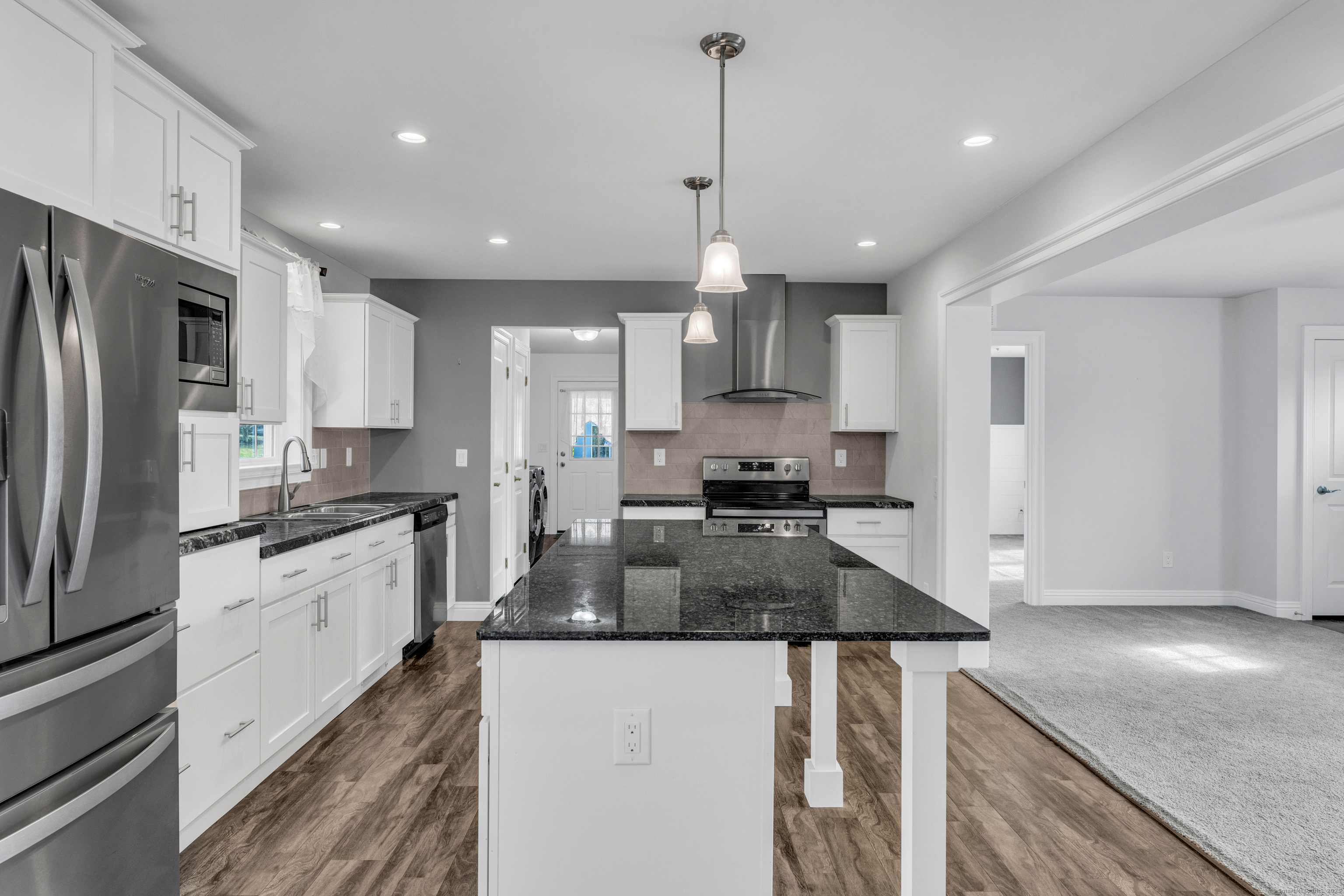 1 High Ridge Circle Montville, CT 06382 - Photo 9 of 39 a kitchen with stainless steel appliances granite countertop a sink refrigerator and cabinets