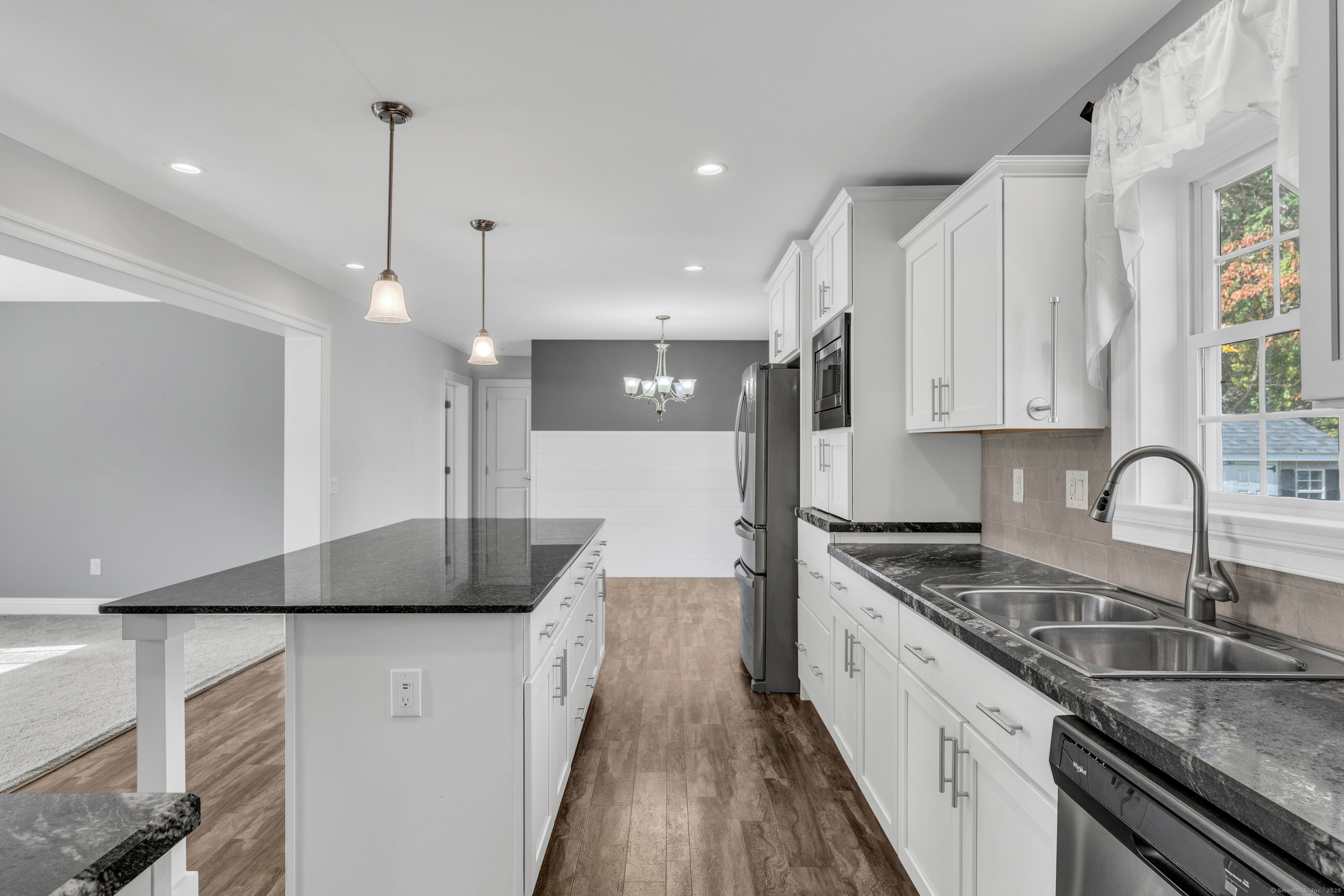 1 High Ridge Circle Montville, CT 06382 - Photo 10 of 39 a kitchen with granite countertop a sink a counter space appliances and cabinets