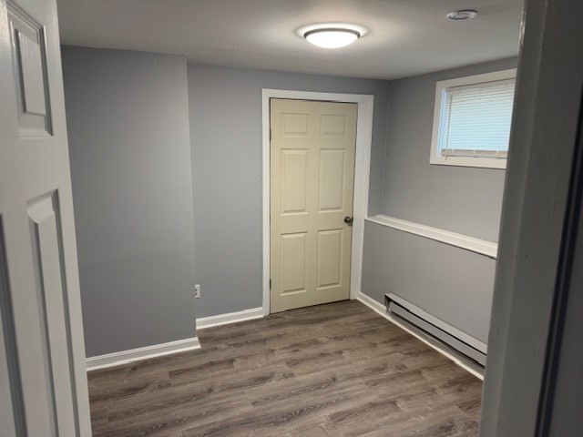 2 Gladeside Terrace, Unit 1 Boston, MA 02126 - Photo 15 of 20 an empty room with wooden floor and closet