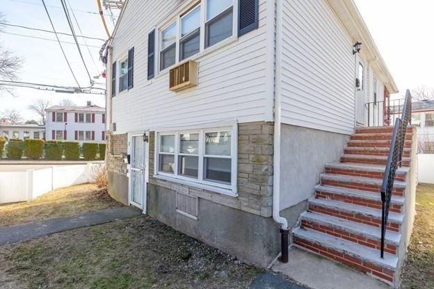 2 Gladeside Terrace, Unit 1 Boston, MA 02126 - Photo 18 of 20 a view of a house with wooden fence and a window