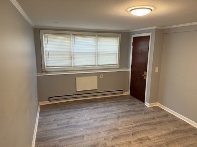 2 Gladeside Terrace, Unit 1 Boston, MA 02126 - Photo 2 of 20 an empty room with wooden floor and windows