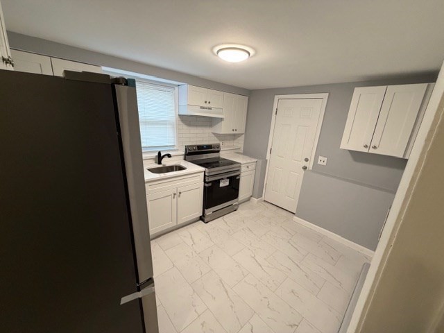 2 Gladeside Terrace, Unit 1 Boston, MA 02126 - Photo 7 of 20 a kitchen with a sink a stove a refrigerator and cabinets