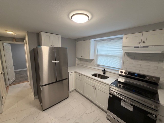 2 Gladeside Terrace, Unit 1 Boston, MA 02126 - Photo 8 of 20 a kitchen with a refrigerator and a sink