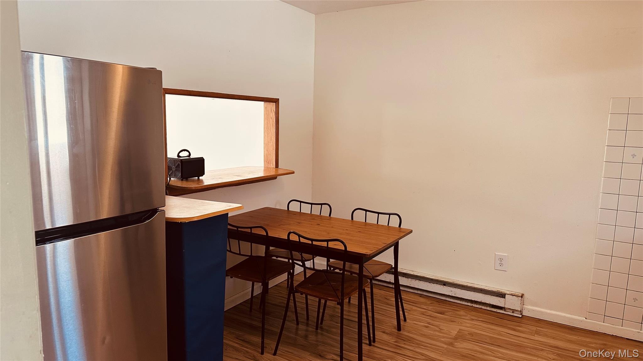 881 Albany Post Road, Unit 17 New Paltz, NY 12561 - Photo 6 of 15 a view of a room with furniture and wooden floor