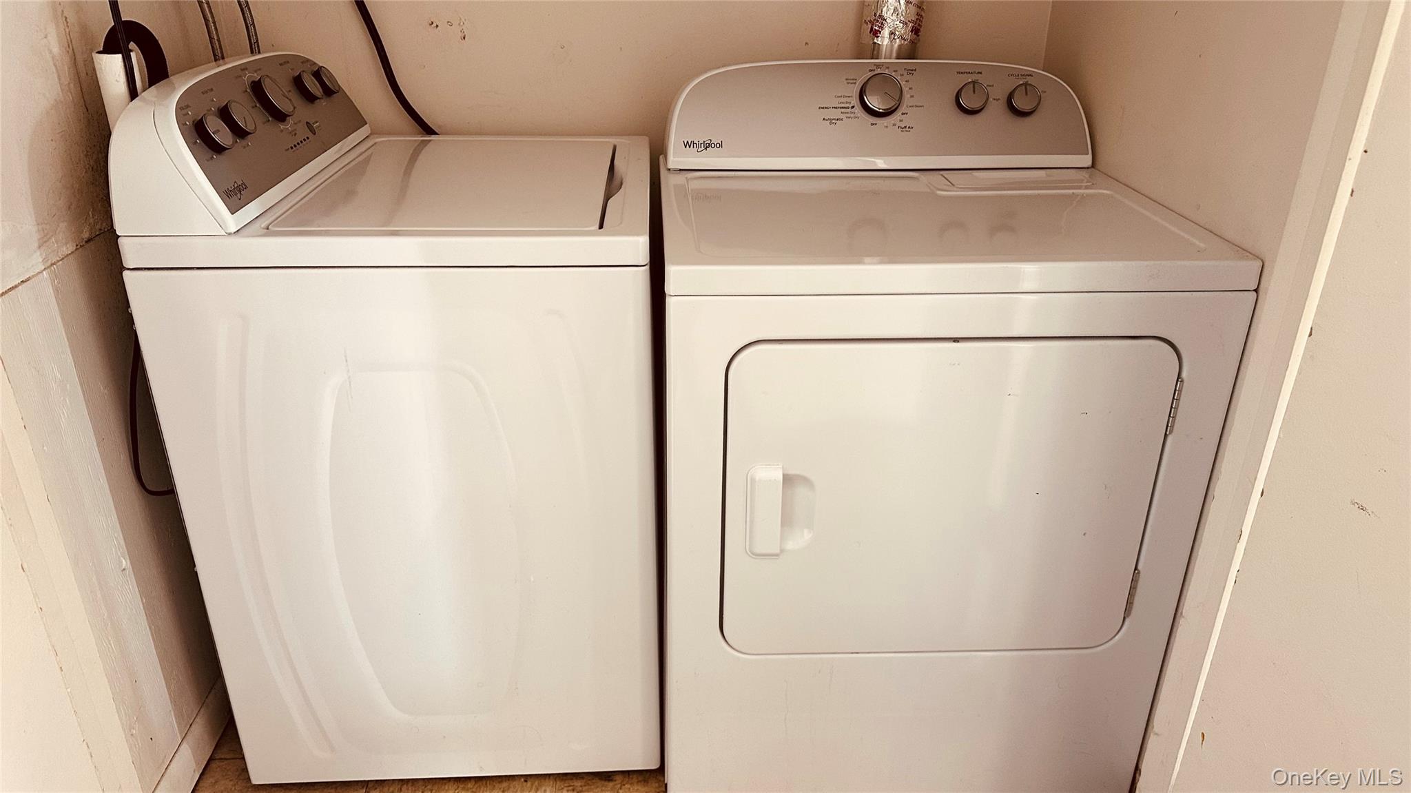 881 Albany Post Road, Unit 17 New Paltz, NY 12561 - Photo 7 of 15 a utility room with dryer and washer