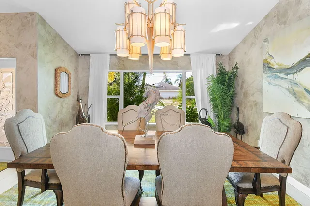 a kitchen with stainless steel appliances granite countertop a sink stove and microwave