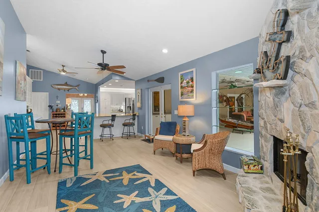 a work room with furniture and a wooden floor