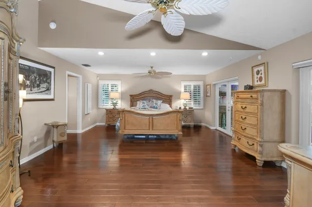 a dining room with furniture a chandelier and a rug