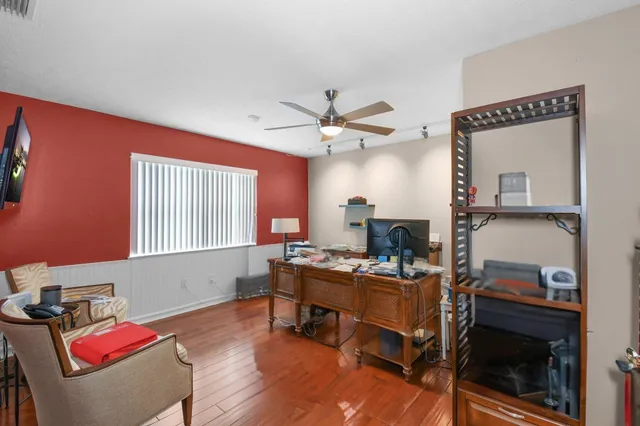 an aerial view of green landscape with trees houses and yard