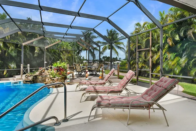 an aerial view of a house with a lake view