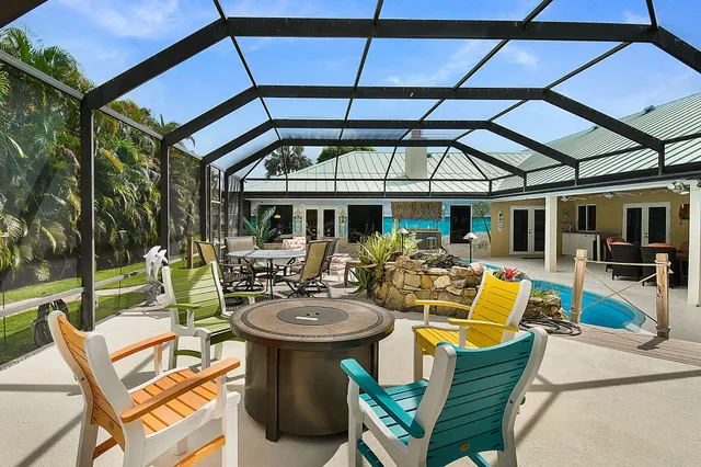 an aerial view of a house with a lake view