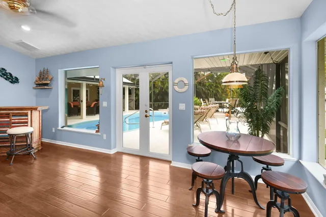 a view of a dining room with furniture window and outside view