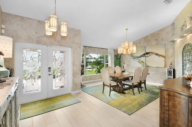 a large living room with stainless steel appliances kitchen island granite countertop furniture and a kitchen view